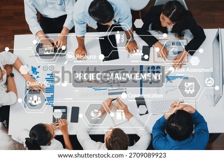 Top view project manager communicate and collaborate with team using project management software, tracking progress of project task and making schedule plan at meeting table. Prudent Amity