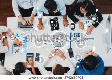 Top view project manager communicate and collaborate with team using project management software, tracking progress of project task and making schedule plan at meeting table. Prudent Amity