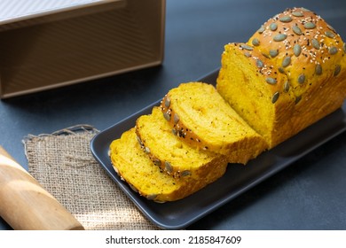 Top View Pumpkin Bread Loaf Sliced On Black Dish