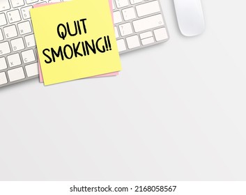 Top view with quit smoking in stickynote  and keyboard on white table background. space for your desing. Business and financial concept.