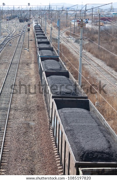 Top\
view of railway and freight train loaded with\
coal