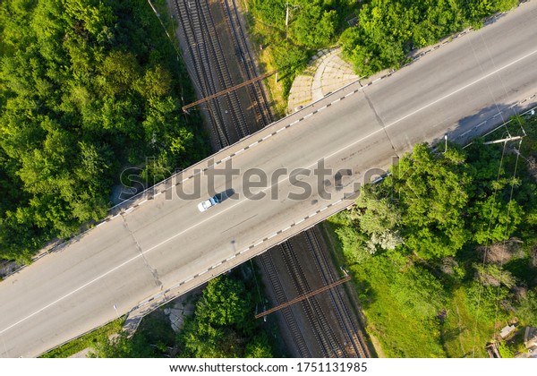 Top view of\
the railway and road. Transport infrastructure. Transportation by\
road and rail. Aerial view.