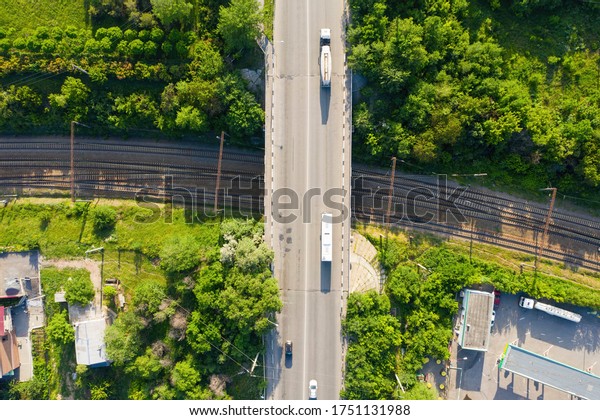 Top view of\
the railway and road. Transport infrastructure. Transportation by\
road and rail. Aerial view.