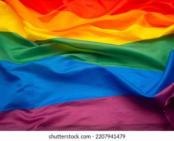 Top View Of The Rainbow Flag Or LGBT Flag. Full Frame Photo. Close-up Photo