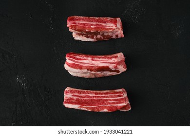 Top View Of Raw Beef Short Ribs, Bone In On Dark Background