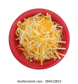 A Top View Of A Red Bowl Of Finely Shredded White, Cheddar, And Mild Cheddar Cheese.