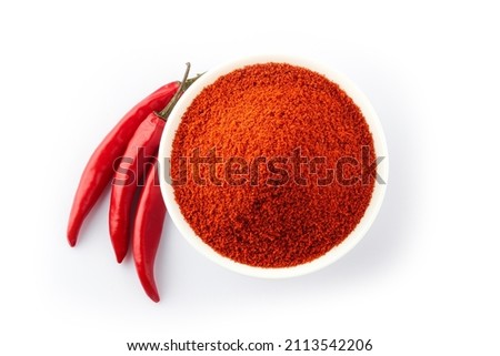 Top View of Red chilly powder in white bowl with red chilly isolated on white background 