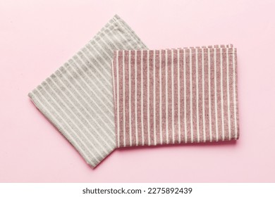 top view with red empty kitchen napkin isolated on table background. Folded cloth for mockup with copy space, Flat lay. Minimal style.
