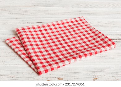 top view with red empty kitchen napkin isolated on table background. Folded cloth for mockup with copy space, Flat lay. Minimal style.