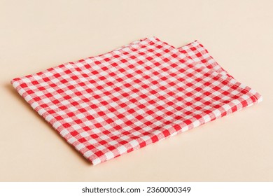 top view with red empty kitchen napkin isolated on table background. Folded cloth for mockup with copy space, Flat lay. Minimal style.