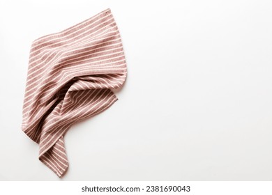 top view with red empty kitchen napkin isolated on table background. Folded cloth for mockup with copy space, Flat lay. Minimal style.
