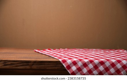 top view with red empty kitchen napkin isolated on table background. Folded cloth for mockup with copy space, Flat lay. Minimal style. High quality photo