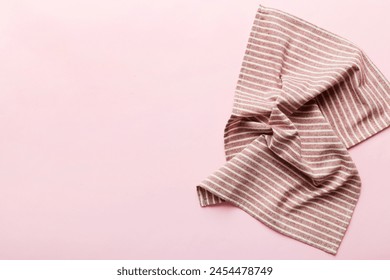 top view with red empty kitchen napkin isolated on table background. Folded cloth for mockup with copy space, Flat lay. Minimal style.