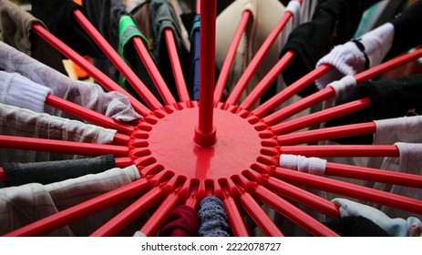 Top View Of Red Folding Hanger Full Of Wet Clothes Hanging Outdoors