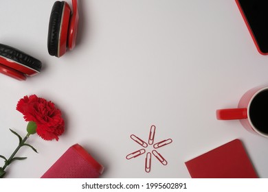 Top View With Red Headset, Coffee Mug, Flower, Clips, Notebook And Bluetooth Speaker, Mock Up Concept, Red Objects.