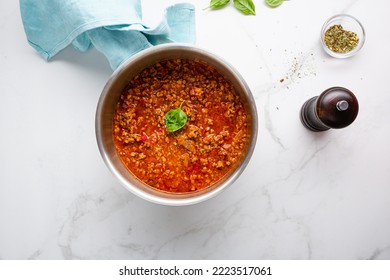 Top View Of Red Meat Sauce In Pan Bolognese On Marble Surface