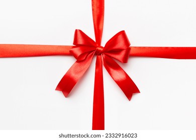 Top view of Red ribbon rolled and red bow isolated on colored background. Flat lay with copy space. - Powered by Shutterstock