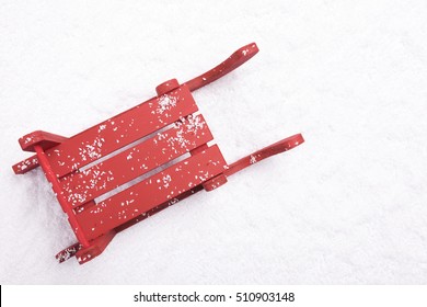 Top View Of Red Sled In The Snow