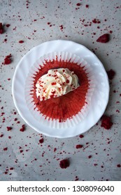 Top View Of A Red Velvet Cupcake Cut In Half On A White Plate. Goal Achievement Concept.