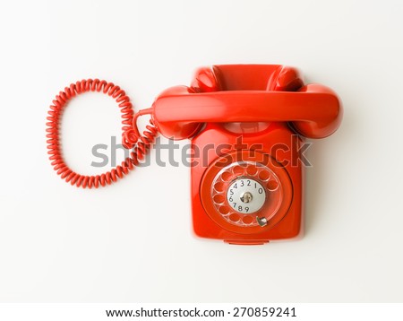 top view of red vintage phone on white background