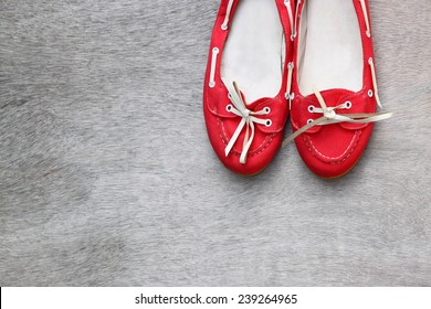 top view of red worn woman shoes over wooden textured background - Powered by Shutterstock