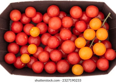 Top view of red and yellow cherry tomatoes in a vegetable cardboard box. - Powered by Shutterstock