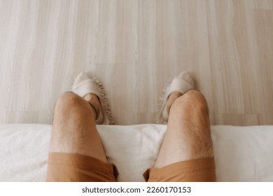 Top view of relax man sitting on sofa with crossing legs in cozy loft room. - Powered by Shutterstock