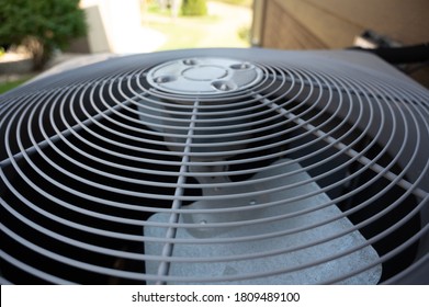 Top View Of  Residential Air Conditioning Unit Outdoors With Fan And Coils