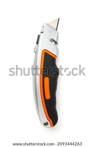 Top view of retractable utility knife isolated on white background.