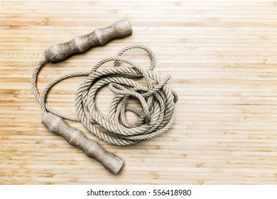 Top View Retro Skipping Rope On Wooden Background