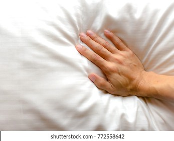 Top View Of Right Hand Woman Pressure White Pillow Or Bedding. Soft Pillow Good Sleep, Good Health. Flat Lay. Copy Space For Any Text Design. Healthcare Concept.