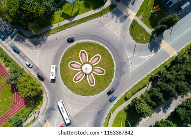 Top View Of The Road With A Circular Motion And A Flower Bed. Aerial Photography.