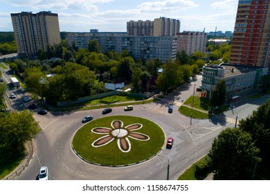 Top View Of The Road With A Circular Motion And A Flower Bed. Aerial Photography.