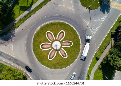 Top View Of The Road With A Circular Motion And A Flower Bed. Aerial Photography.