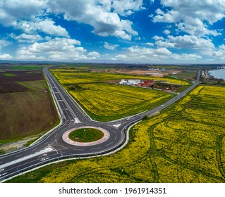 Top View Of The Road With A Circular Motion And A Flower Bed. Aerial Photography.