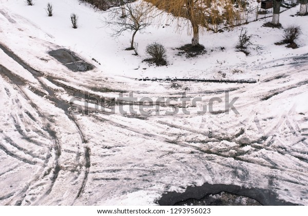 The top view of the\
road is not cleared of snow, the journey through the road is very\
heavy, the car can get stuck. The snow is drowning - do not go on\
foot or drive a car
