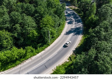 Top view of the road with a sharp turn on which the car moves