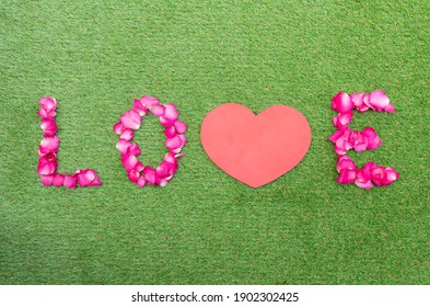 Top view rose petals in a row of love with mock up red heart. Valentine day concept