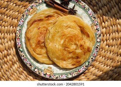 Top View Roti Canai Or Flat Bread On The Table With Sunny Day