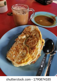 Top View Of Roti Canai On Blue Plate 