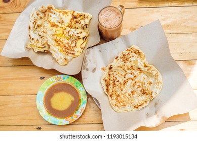 Top View Of Roti Canai  Teh Tarik And Curry