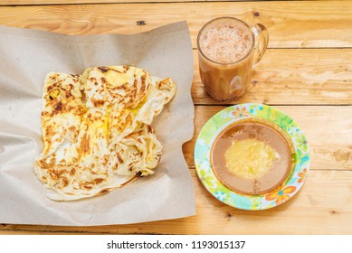 Top View Of Roti Canai  Teh Tarik And Curry