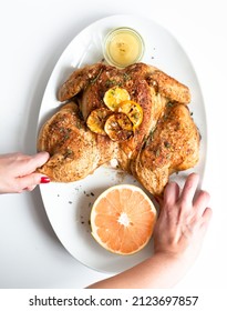 A Top View Of Rotisserie Chicken With Citrus