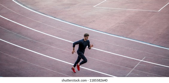 Top View Of Runner Jogging On Race Track