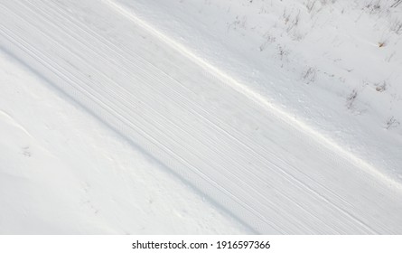 Top View Of Rural Snowy Road In Winter