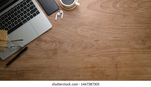 Top view of rustic workplace style with laptop and office supplies 