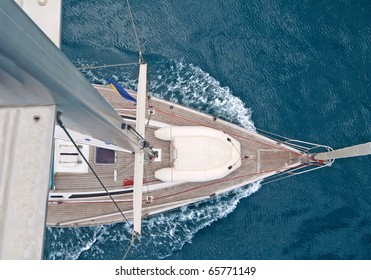 Top View Of Sailing Boat With Water Splash