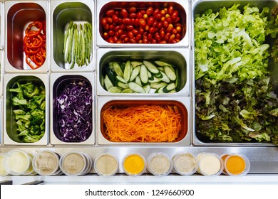 Top View Of Salad Bar With Assortment Of Ingredients. For Healthy And Diet Meal.