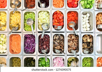 Top View Of Salad Bar With Assortment Of Ingredients