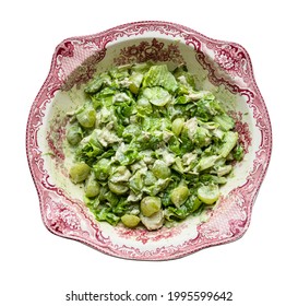 Top View Of Salad With Grapes, Tarragon And Chicken In Ornamental Bowl Cutout On White Background